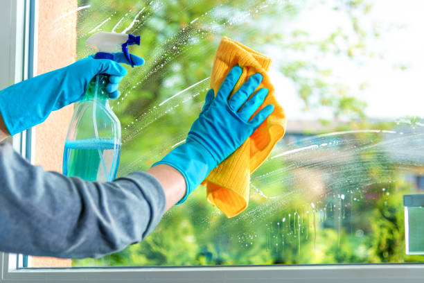 Cleaning window pane with detergent, spring cleaning concept Cleaning window pane with detergent, spring cleaning concept